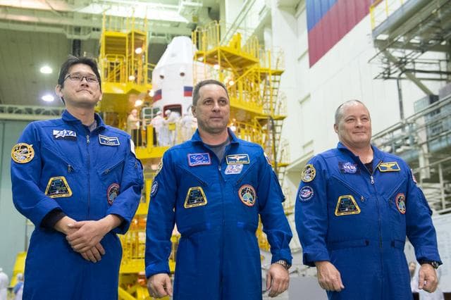 NASA image: jsc2017e138128 - At the Integration Facility at the Baikonur Cosmodrome in Kazakhstan, Expedition 54-55 prime crewmembers Norishige Kanai of the Japan Aerospace Exploration Agency (JAXA, left), Anton Shkaplerov the Russian Federal Space Agency (Roscosmos,