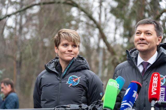 NASA image: jsc2018e097268 - Expedition 58 crewmember Anne McClain of NASA (left) looks on as crewmate Oleg Kononenko of Roscosmos answer reporters’ questions Nov. 19 at the Gagarin Cosmonaut Training Center in Star City, Russia before boarding a plane to fly to th
