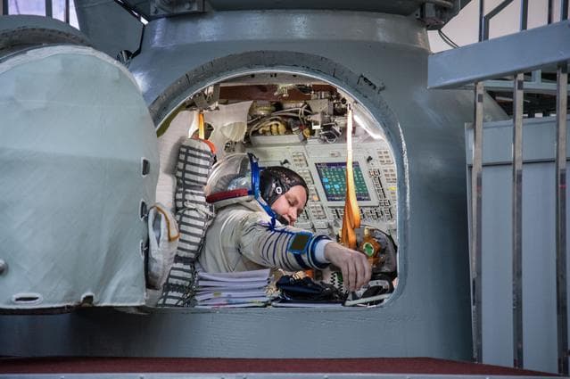 NASA image: Alexey Ovchinin of Roscosmos inside a Soyuz spacecraft simulator