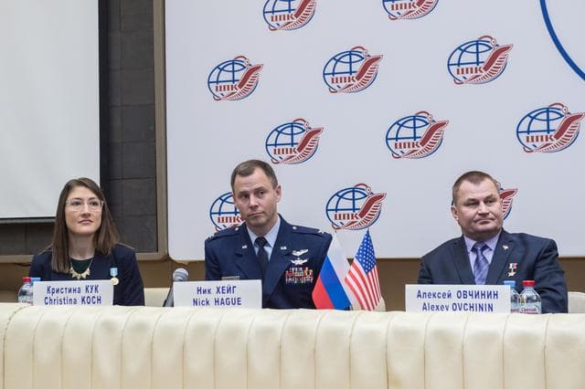 NASA image: jsc2019e004417 - At the Gagarin Cosmonaut Training Center in Star City, Russia, Expedition 59 crewmembers Christina Koch of NASA (left), Nick Hague of NASA (center) and Alexey Ovchinin of Roscosmos (right) listen to reportersâ€™ questions Feb. 21 during a