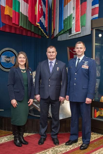 NASA image: jsc2019e004428 - At the Gagarin Museum in the Gagarin Cosmonaut Training Center in Star City, Russia, Expedition 59 crewmembers Christina Koch of NASA (left), Alexey Ovchinin of Roscosmos (center) and Nick Hague of NASA (right) pose for pictures Feb. 21 f