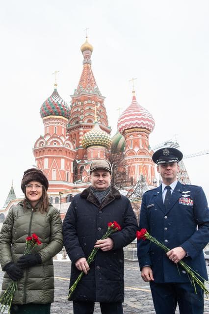NASA image: jsc2019e004430 - With St. Basilâ€™s Cathedral in Red Square in Moscow providing a wintry backdrop, Expedition 59 crewmembers Christina Koch of NASA (left), Alexey Ovchinin of Roscosmos (center) and Nick Hague of NASA (right) pose for pictures Feb. 21 prio