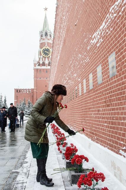 NASA image: jsc2019e004436 - At the Kremlin Wall in Moscow, Expedition 59 crewmember Christina Koch of NASA lays flowers where Russian space icons are interred in traditional ceremonies Feb. 21. Koch, Nick Hague of NASA and Alexey Ovchinin of Roscosmos will launch Ma