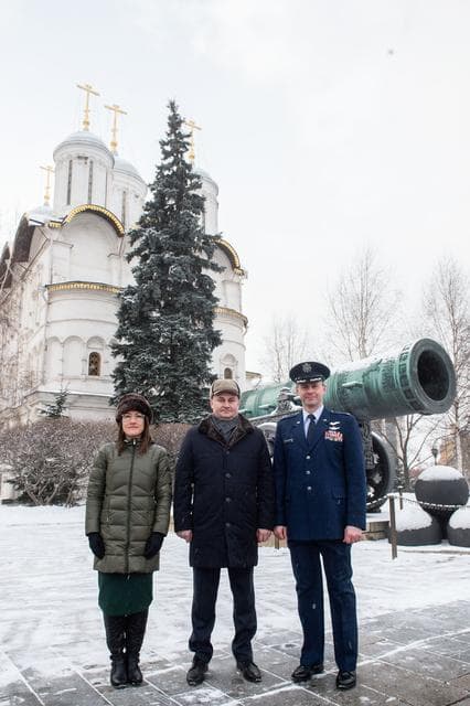 NASA image: jsc2019e004439 - Inside the Kremlin in Moscow, Expedition 59 crewmembers Christina Koch of NASA (left), Alexey Ovchinin of Roscosmos (center) and Nick Hague of NASA (right) pose for pictures in front of the Tsar Cannon on a wintry day Feb. 21 as part of t