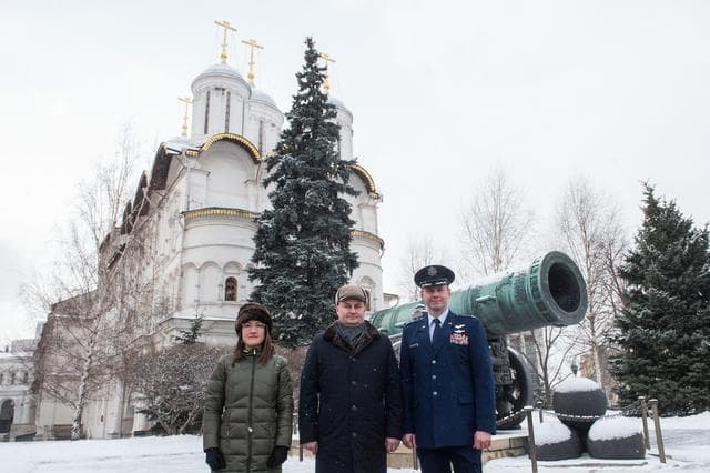 NASA image: jsc2019e004440 - Inside the Kremlin in Moscow, Expedition 59 crewmembers Christina Koch of NASA (left), Alexey Ovchinin of Roscosmos (center) and Nick Hague of NASA (right) pose for pictures in front of the Tsar Cannon on a wintry day Feb. 21 as part of t