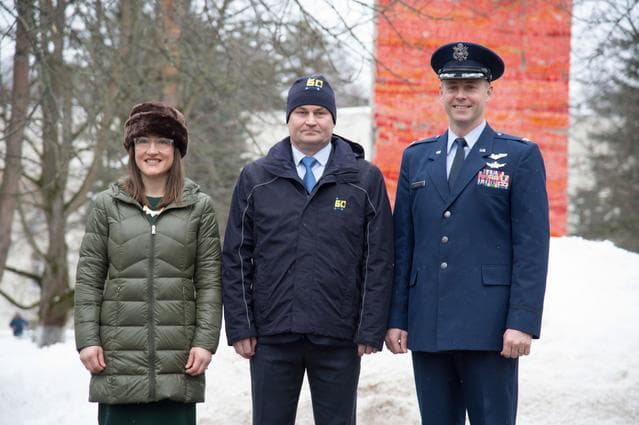 NASA image: At the Gagarin Cosmonaut Training Center in Star City, Russia, Expedition 59 crewmembers Christina Koch of NASA (left), Alexey Ovchinin of Roscosmos (center) and Nick Hague of NASA (right) pose for pictures Feb. 26 as they prepared to depart for their lau