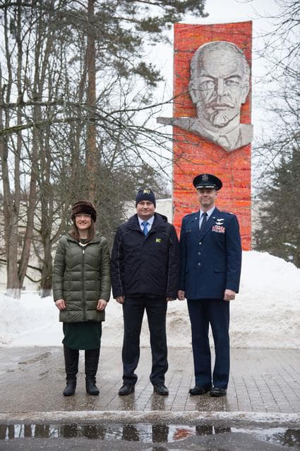 NASA image: At the Gagarin Cosmonaut Training Center in Star City, Russia, Expedition 59 crewmembers Christina Koch of NASA (left), Alexey Ovchinin of Roscosmos (center) and Nick Hague of NASA (right) pose for pictures Feb. 26 in front of the statue of Vladimir Lenin
