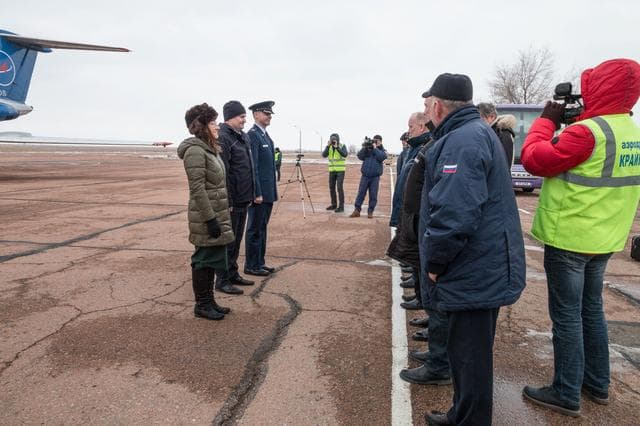 NASA image: jsc2019e007201 - Expedition 59 crewmembers Christina Koch of NASA (left), Alexey Ovchinin of Roscosmos (center) and Nick Hague of NASA (right) meet with Russian space officials after arriving at the Baikonur Cosmodrome in Kazakhstan Feb. 26 for final pre-