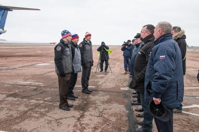 NASA image: jsc2019e007204 - Expedition 59 backup crewmembers Drew Morgan of NASA (left), Alexander Skvortsov of Roscosmos (center) and Luca Parmitano of the European Space Agency (right) meet with Russian officials Feb. 26 after arriving at the Baikonur Cosmodrome i