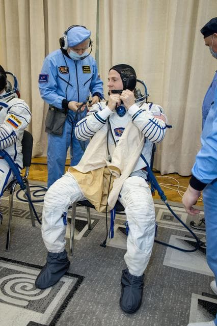 NASA image: jsc2019e009946 - At the Baikonur Cosmodrome in Kazakhstan, Expedition 59 crewmember Nick Hague of NASA suits up for a Soyuz fit check dress rehearsal Feb. 27 during pre-launch training. Hague, Christina Koch of NASA and Alexey Ovchinin of Roscosmos will l