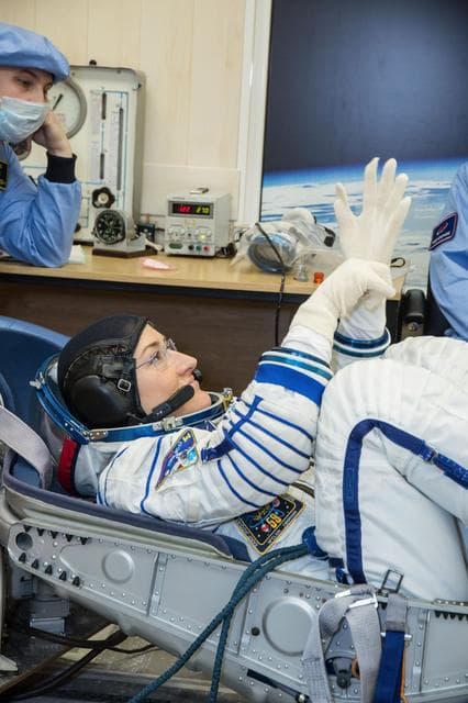 NASA image: jsc2019e009952 - At the Baikonur Cosmodrome in Kazakhstan, Expedition 59 crewmember Christina Koch of NASA undergoes a Sokol launch suit pressure check Feb. 27 during pre-launch training. Koch, Nick Hague of NASA and Alexey Ovchinin of Roscosmos will laun