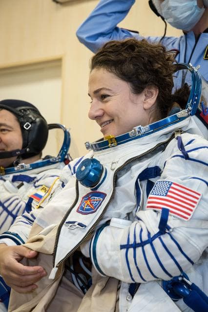NASA image: jsc2019e052885 - In the Integration Building at the Baikonur Cosmodrome in Kazakhstan, Expedition 61 crewmember Jessica Meir of NASA suits up Sept. 11 for a fit check aboard the Soyuz MS-15 spacecraft. Meir, Hazzaa Ali Almansoori of the United Arab Emirat