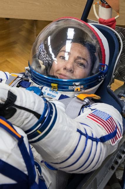 NASA image: jsc2019e052887 - In the Integration Building at the Baikonur Cosmodrome in Kazakhstan, Expedition 61 crewmember Jessica Meir of NASA undergoes a pressure and leak check of her Russian Sokol launch and entry suit Sept. 11 for a fit check aboard the Soyuz M