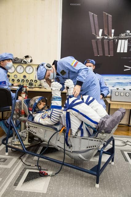 NASA image: jsc2019e052889 - In the Integration Building at the Baikonur Cosmodrome in Kazakhstan, spaceflight participant Hazzaa Ali Almansoori of the United Arab Emirates undergoes a pressure and leak check of his Russian Sokol launch and entry suit Sept. 11 for a 