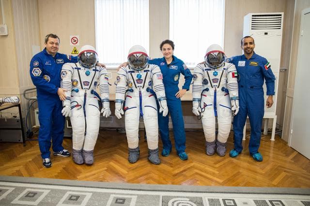 NASA image: jsc2019e052897 - In the Integration Building at the Baikonur Cosmodrome in Kazakhstan, Expedition 61 crewmembers Oleg Skripochka of Roscosmos (left) and Jessica Meir of NASA (center) and spaceflight participant Hazzaa Ali Almansoori of the United Arab Emi