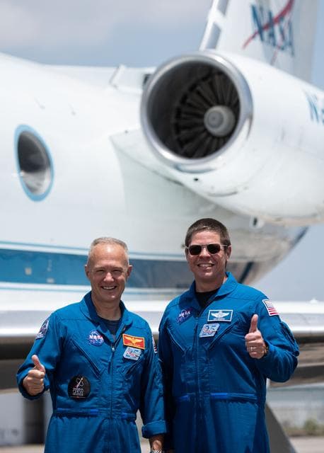 NASA image: jsc2020e023070 - At Ellington Field near NASAâ€™s Johnson Space Center in Houston, astronauts Douglas Hurley(left) and Robert Behnken pose for a photo before boarding the Gulfstream jet that will carry them to the agencyâ€™s Kennedy Space Center in Florid