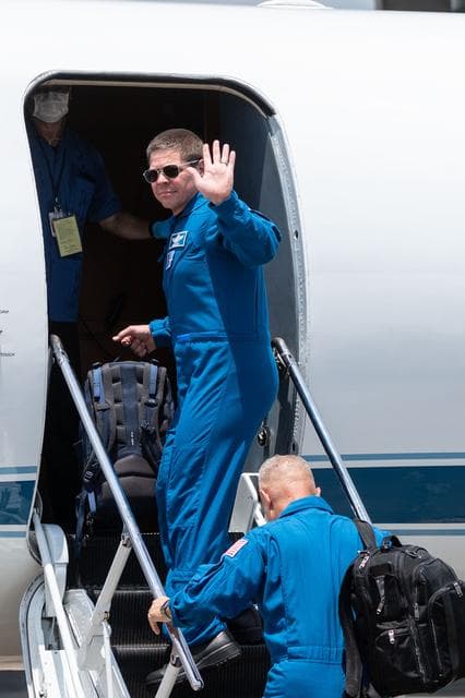 NASA image: jsc2020e023072 - At Ellington Field near NASA’s Johnson Space Center in Houston, astronauts Robert Behnken(facing) and Douglas Hurley board the Gulfstream jet that will carry them to the agency’s Kennedy Space Center in Florida on May 20, 2020, in pre