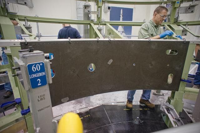 NASA image: Installing the first composite panel on the EFT-1 Service Module