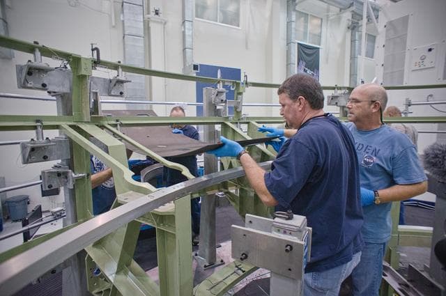 NASA image: Installing the first composite panel on the EFT-1 Service Module