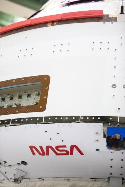 NASA image: NASA and ESA logo installation on Artemis I spacecraft