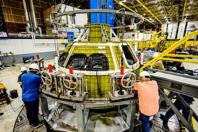 NASA image: Orion crew module pressure vessel lifted from welding tool