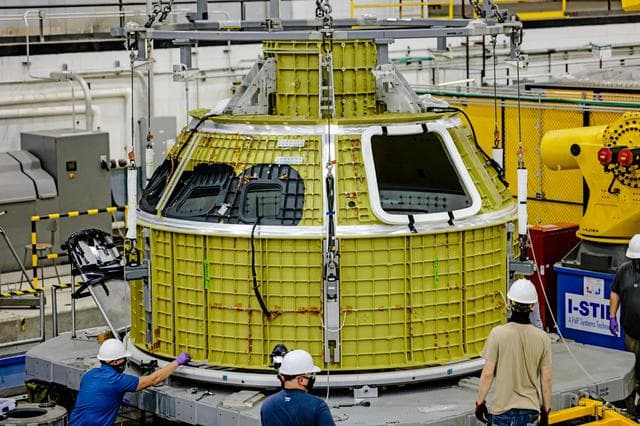 NASA image: Orion crew module pressure vessel lifted from welding tool