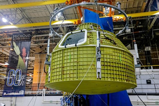 NASA image: Orion crew module pressure vessel lifted from welding tool