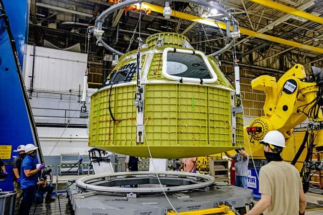 NASA image: Orion crew module pressure vessel lifted from welding tool