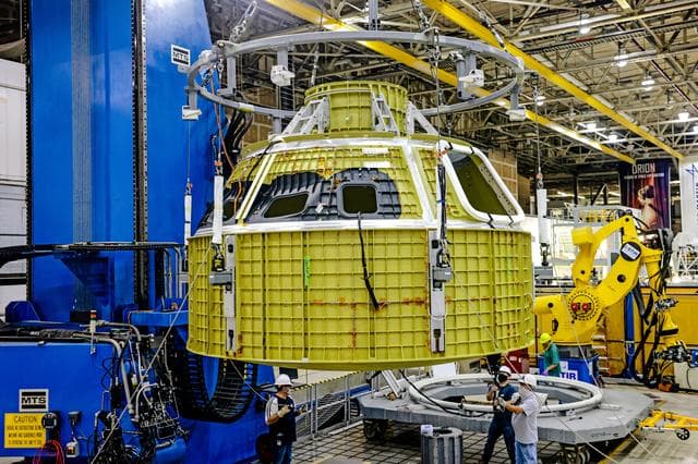 NASA image: Orion crew module pressure vessel lifted from welding tool
