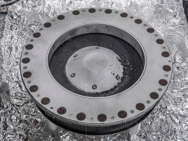 NASA image: OSIRIS-REx - TAGSAM sample on mylar flap jsc2023e058642