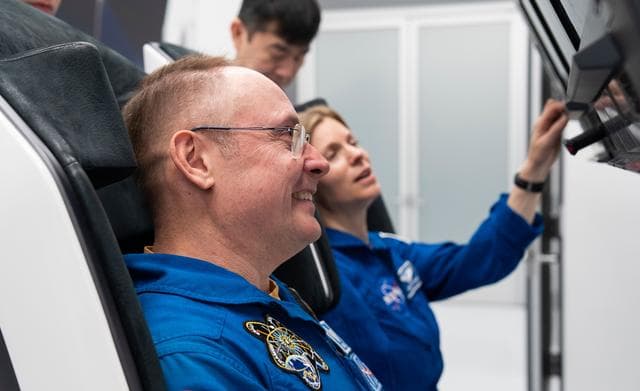 NASA image: Astronaut Mike Fincke trains inside a Dragon training crew spacecraft