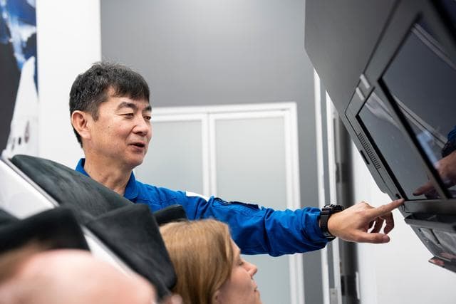 NASA image: Astronaut Kimiya Yui trains inside a Dragon training crew spacecraft