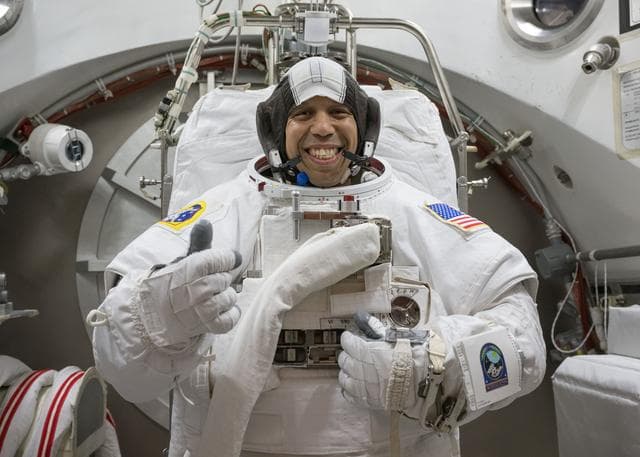 NASA image: NASA astronaut Chris Williams poses for a photo in a spacesuit