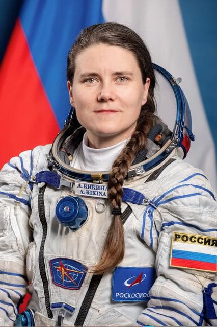 NASA image: Soyuz MS-28 Backup Flight Engineer Anna Kikina poses for a portrait in her Sokol launch and entry suit