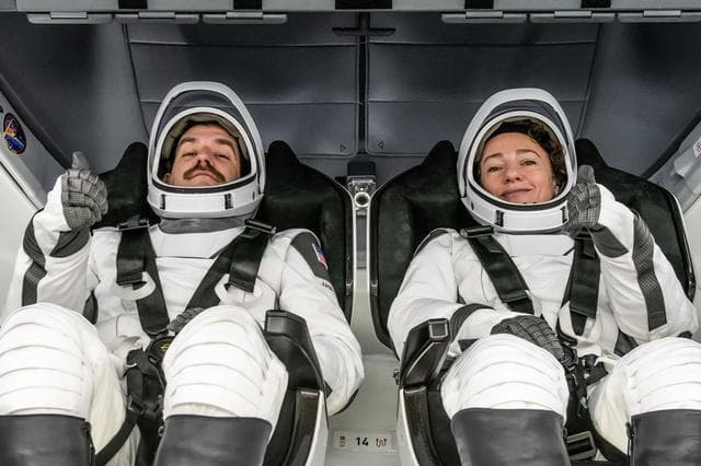 NASA image: NASA astronauts Jack Hathaway and Jessica Meir are photographed inside the Dragon spacecraft