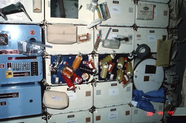 NASA image: Columbia, OV-102, forward middeck locker experiments and meal tray assemblies