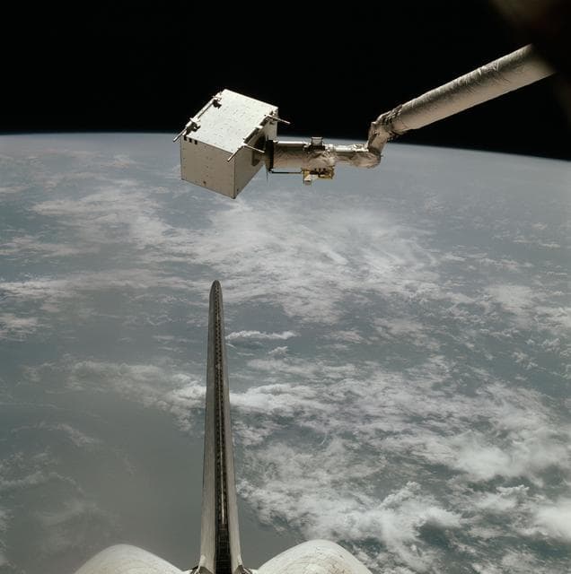 NASA image: View of the Columbia's RMS arm and end effector grasping IECM