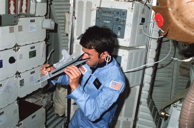NASA image: Mission Specialist Lenoir checks vision using DIOPTER measuring device