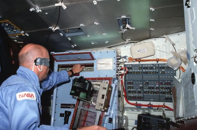 NASA image: MS Musgrave conducts CFES experiment on middeck