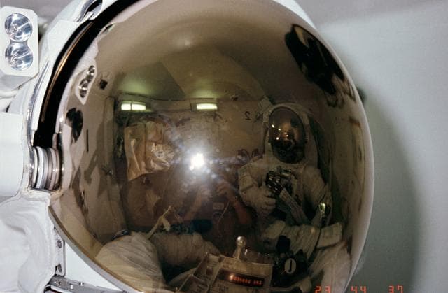 NASA image: Fully EMU suited MS Peterson and MS Musgrave in airlock