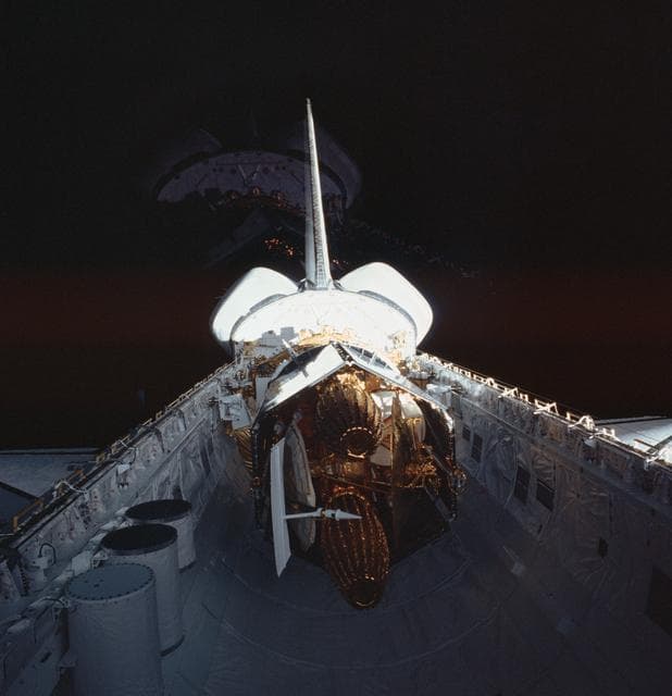 NASA image: Reflected view of the TDRS in the STS-6 Challengers payload bay
