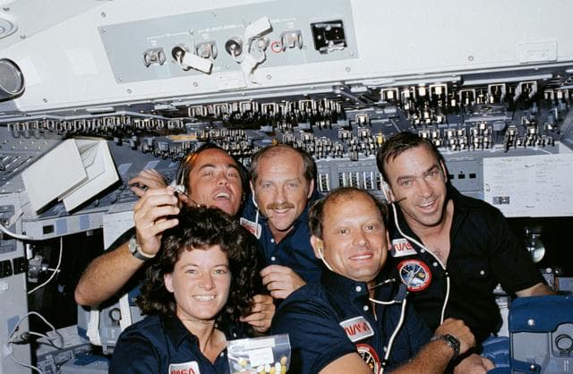 NASA image: Crew members pose for group portrait on forward flight deck