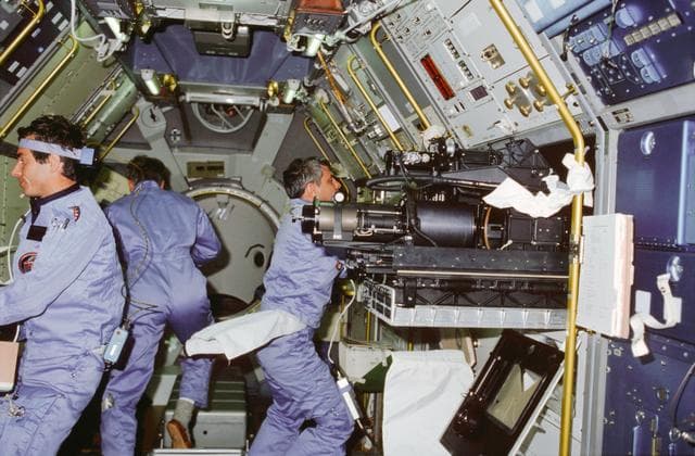 NASA image: STS-9 crewmembers work in the Spacelab 1 module