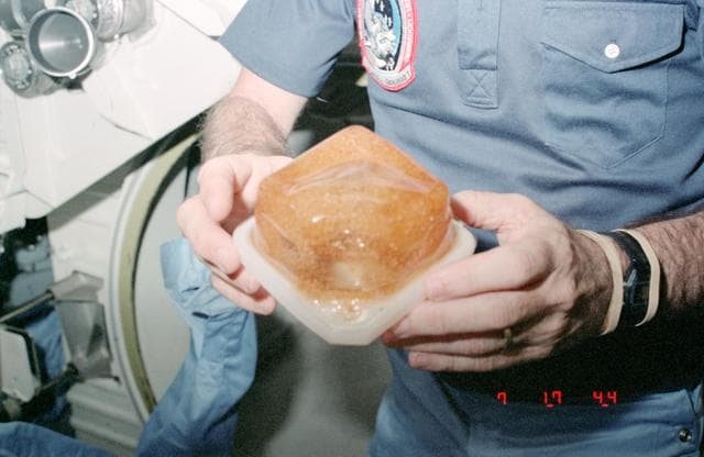 NASA image: Water and coffee in beverage container during STS-9 flight
