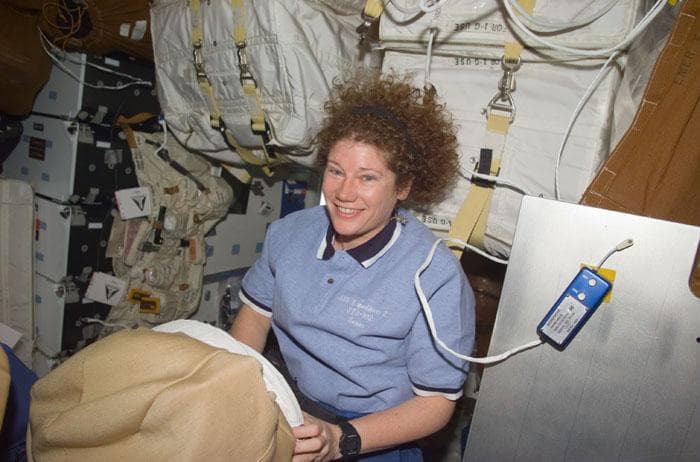 NASA image: Helms with her EMU helmet in the middeck