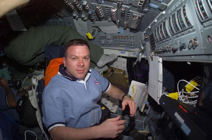 NASA image: Kelly in the commander's seat in the flight deck