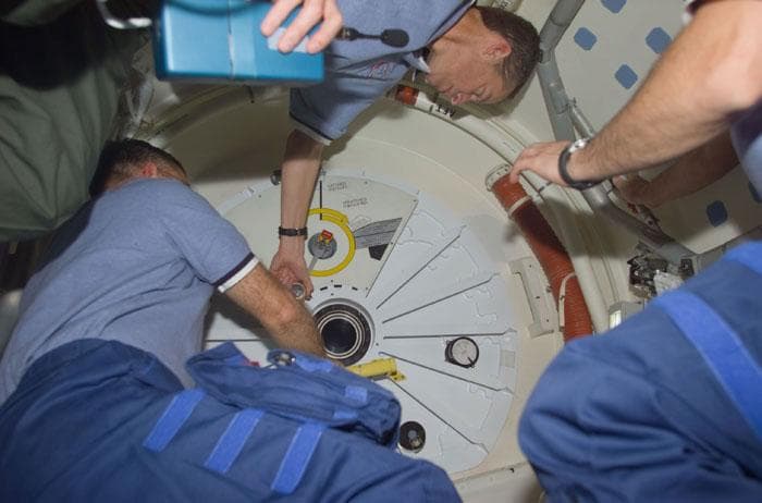 NASA image: Voss and Wetherbee open the hatch to the ISS