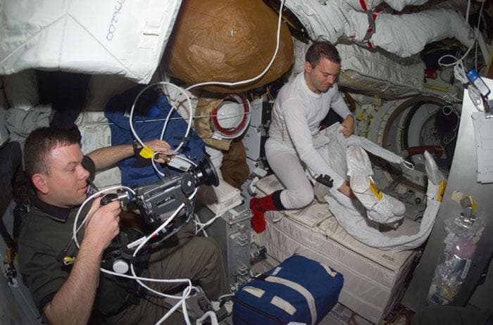 NASA image: Kelly uses video camera to document Richards preparing for EVA