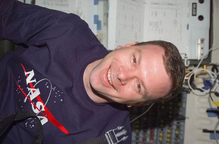 NASA image: Kelly smiles for the camera in the middeck
