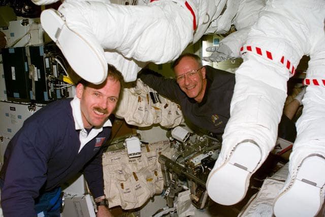 NASA image: MS Smith and Nicollier on the Discovery's middeck with EMU's